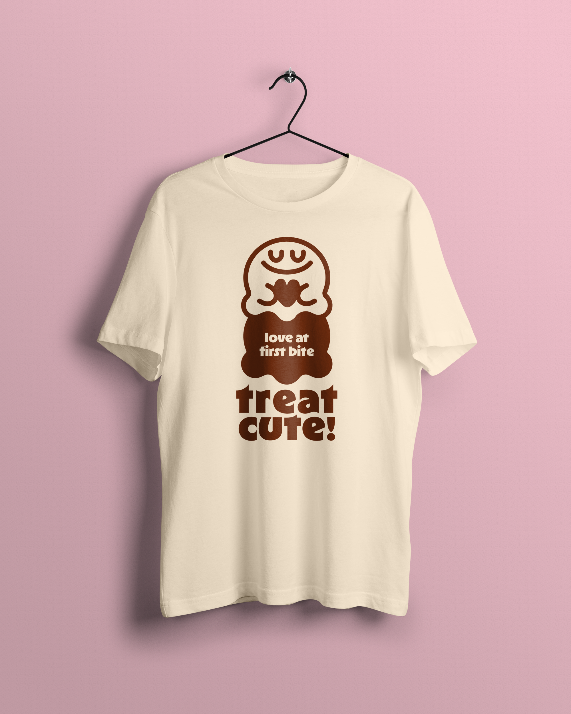 An off-white t-shirt with the Treat Cute logo on it. Additional text reads 'Love at First Bite'